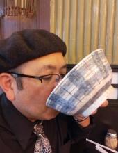 Gil Asakawa slurping down tonkotsu soup.